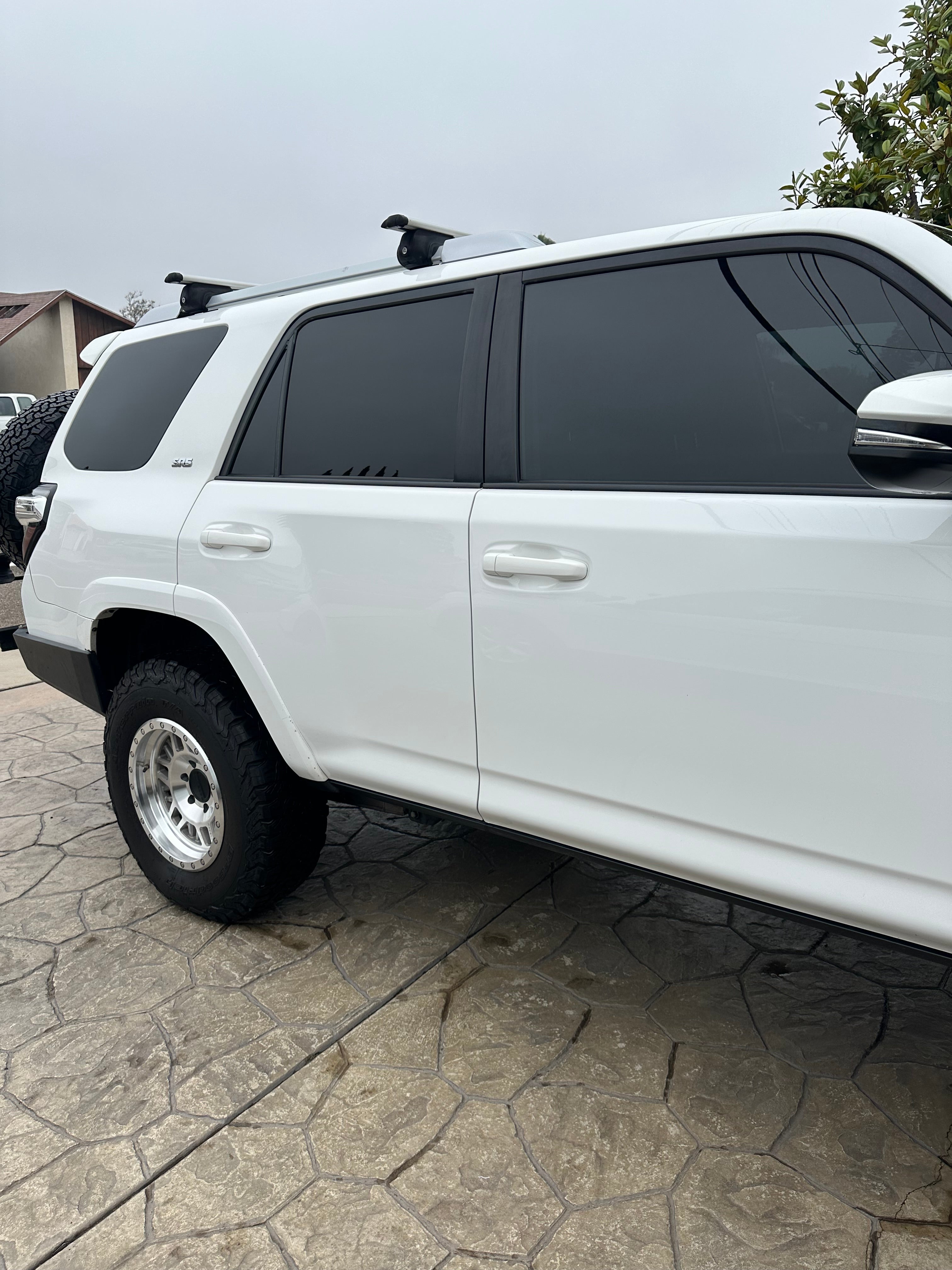 White SUV showcasing excellent auto detailing with glossy finish and tinted windows.